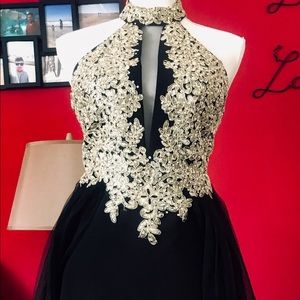 Beautiful black dress with gold detailing.Size7